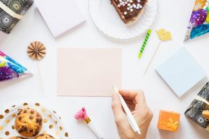 a shot of a hand writing on a card